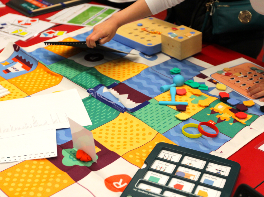Child playing with Cubetto.